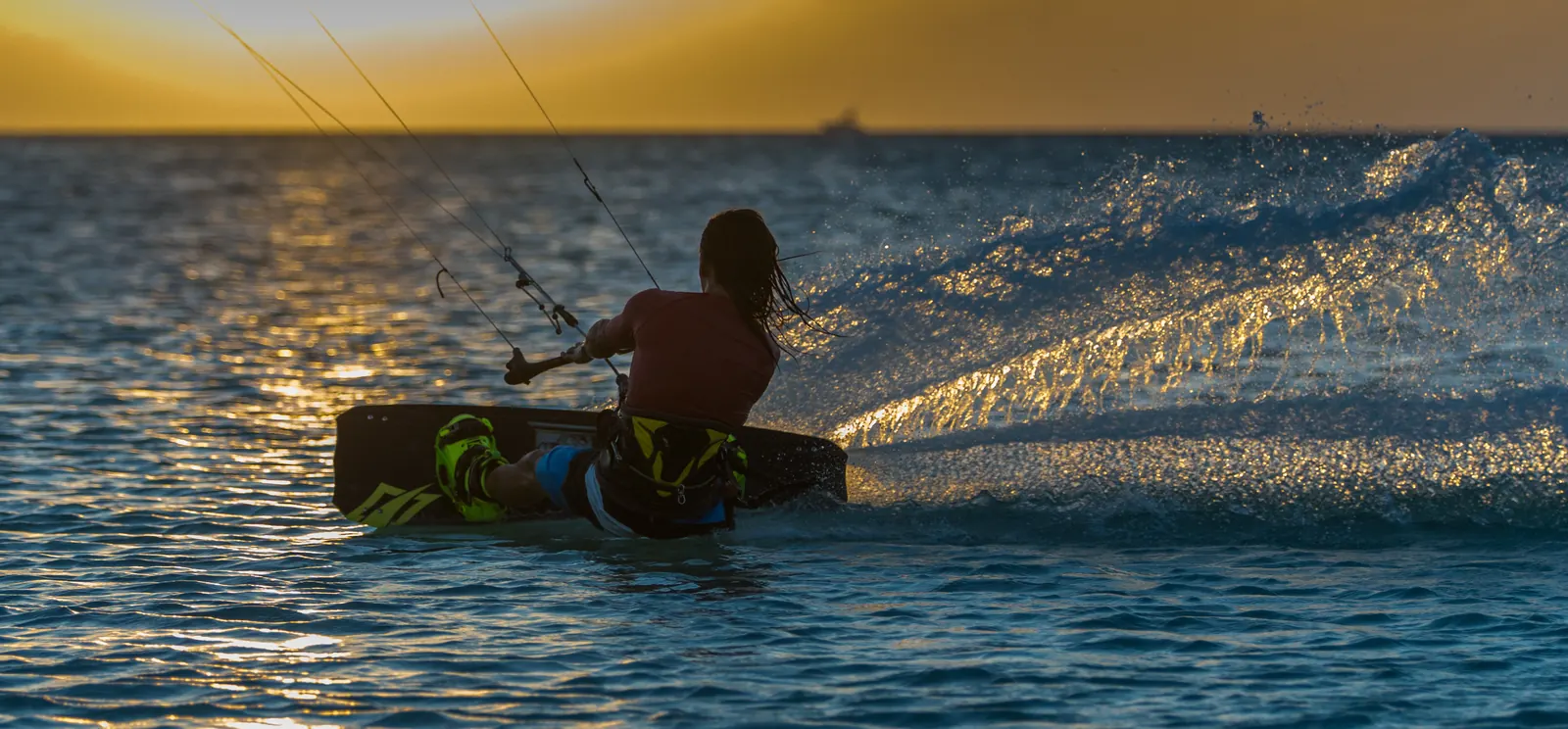 Kitesurfer riding at sunset in Aruba